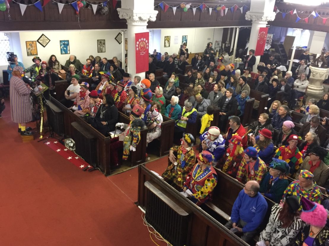 Clowns line the rows of All Saints church in east London. 