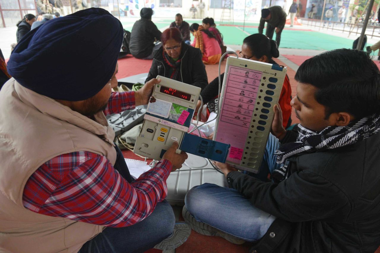 Indian election officials examine Electronic Voting Machines (EVM) at a distribution centre in Amritsar on February 3. The final count is on March 11, after a seven-phase voting period.