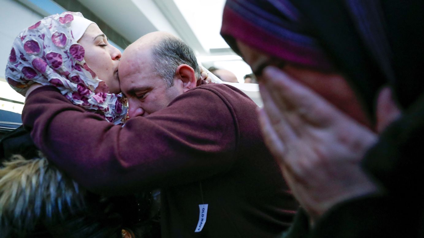 Syrian refugee Baraa Haj Khalaf kisses her father, Khaled, after arriving at Chicago's O'Hare International Airport on Tuesday, February 7. She arrived with her partner and their 16-month-old daughter after being told last week that they couldn't fly to the United States because of an executive order signed by President Donald Trump. That order, which temporarily suspended the admission of refugees and barred entry to the United States from seven Muslim-majority countries, was blocked by a federal judge. A federal appeals court <a href="http://www.cnn.com/2017/02/09/politics/travel-ban-9th-circuit-ruling-immigration/index.html" target="_blank">upheld the ruling</a> on Thursday, February 9.