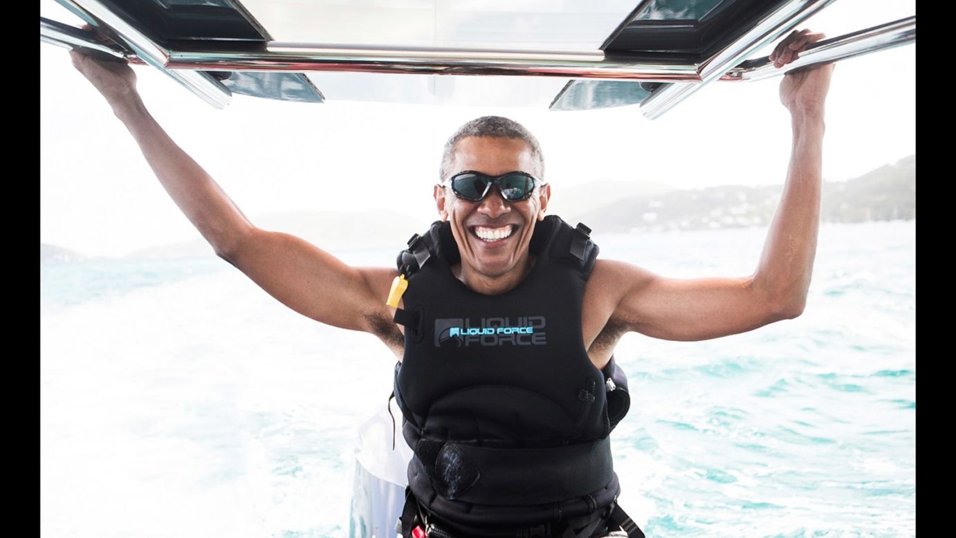 Former US President Barack Obama prepares to kitesurf during a vacation in the British Virgin Islands. Obama learned to kitesurf as part of <a href="http://www.cnn.com/2017/02/07/politics/barack-obama-kitesurfing-richard-branson/" target="_blank">a friendly challenge</a> with billionaire Richard Branson.
