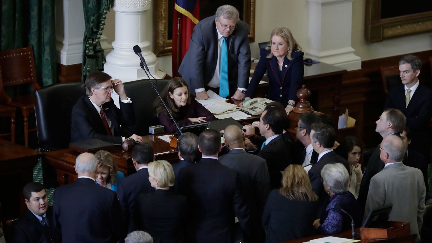 Texas state senators gather around Lt. Gov. Dan Patrick, back left, during a debate over a bill on Tuesday, February 7. The Senate <a href="http://www.cnn.com/2017/02/07/us/texas-sanctuary-city-fight/" target="_blank">cleared a bill</a> that would withhold state dollars for "sanctuary cities" where police fail to enforce immigration laws at the request of federal officials. The measure came just days after President Trump signed an executive order that strips states and cities of federal funding if they "attempt to shield aliens from deportation."