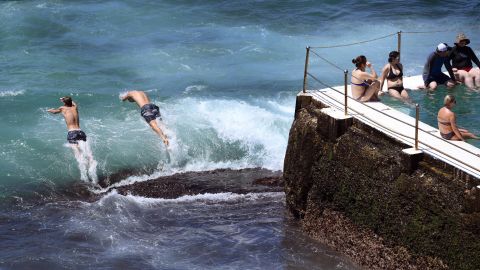 Swimmers jump into the surf at Sydney's Bondi Beach.