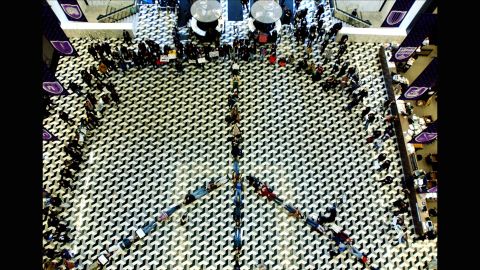 <strong>New York University</strong> students lay down to form a peace symbol on the floor of the NYU library in 2003 to protest the impending war in Iraq.