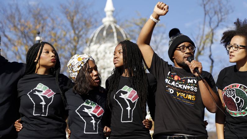 <strong>University of Missouri</strong> graduate student Jonathan Butler, second from right, speaks on November 9, 2015, following the announcement that University of Missouri System President Tim Wolfe would resign. Wolfe stepped down amid widespread protests over his handling of racial tensions at the Columbia, Missouri school. 