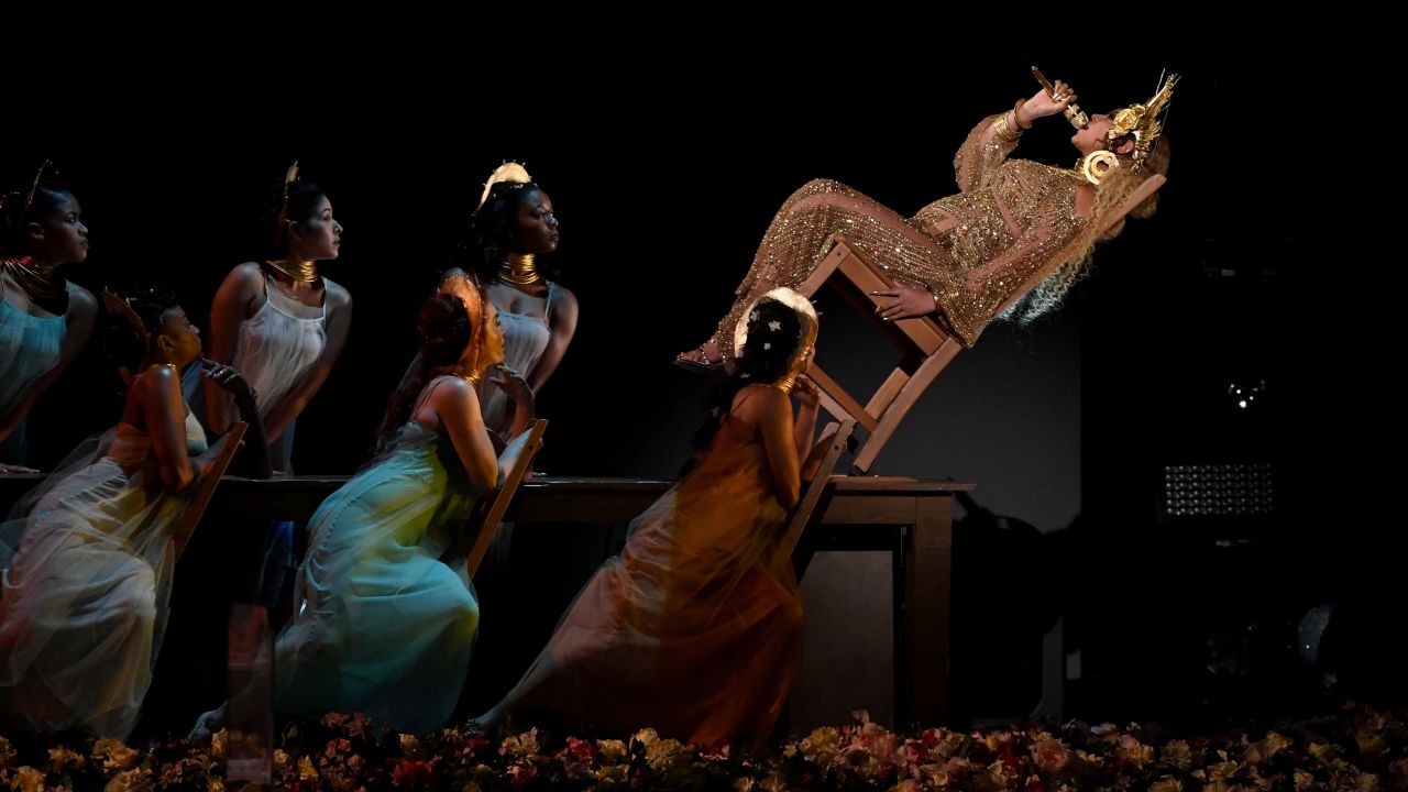 LOS ANGELES, CA - FEBRUARY 12:  Recording artist Beyonce (R, holding microphone) performs onstage during The 59th GRAMMY Awards at STAPLES Center on February 12, 2017 in Los Angeles, California.  (Photo by Kevin Winter/Getty Images for NARAS)