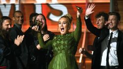 Adele, winner of Album of the Year for '25,' holds up a broken Grammy Award onstage during The 59th Grammy Awards at Staples Center on February 12, 2017 in Los Angeles, California.
