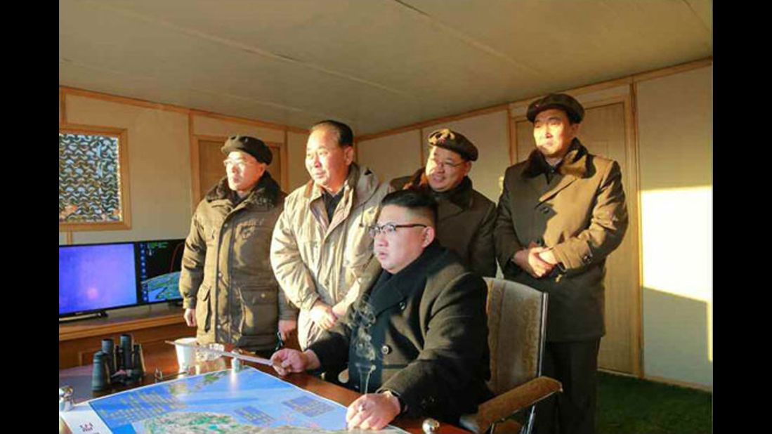 North Korean leader Kim Jong Un looks on as the country tests a new intermediate-range ballistic missile. 