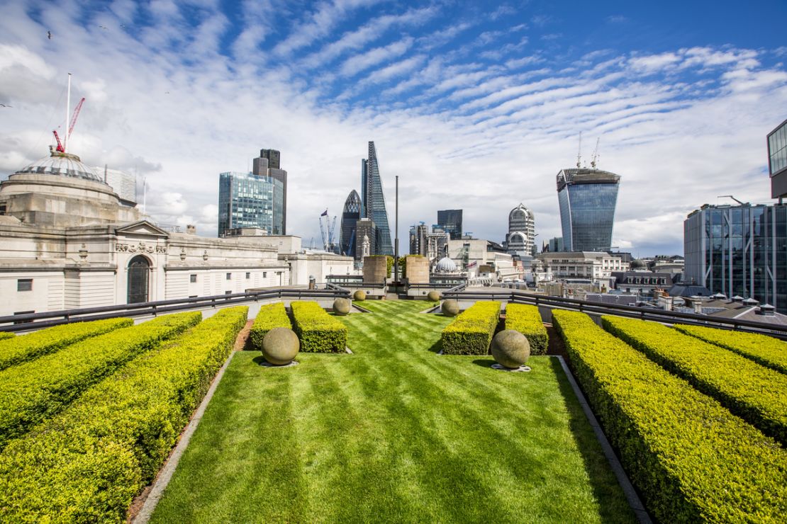 Admire London's eastern cluster of skyscrapers from Coq d'Argent's manicured lawn.