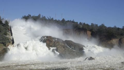 Water gushes over the main spillway at Oroville Dam on February 11. 
