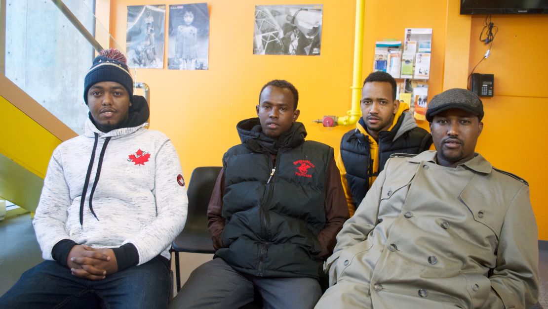 Hussein Ahmed, far right, and Mohamed Hossain, far left, thought they might die during the icy trek this weekend from Minnesota to Canada.