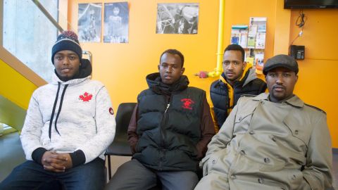 Hussein Ahmed, far right, and Mohamed Hossain, far left, thought they might die during the icy trek this weekend from Minnesota to Canada.