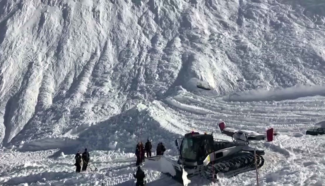 Rescuers work at the site of the avalanche in Tignes, France.