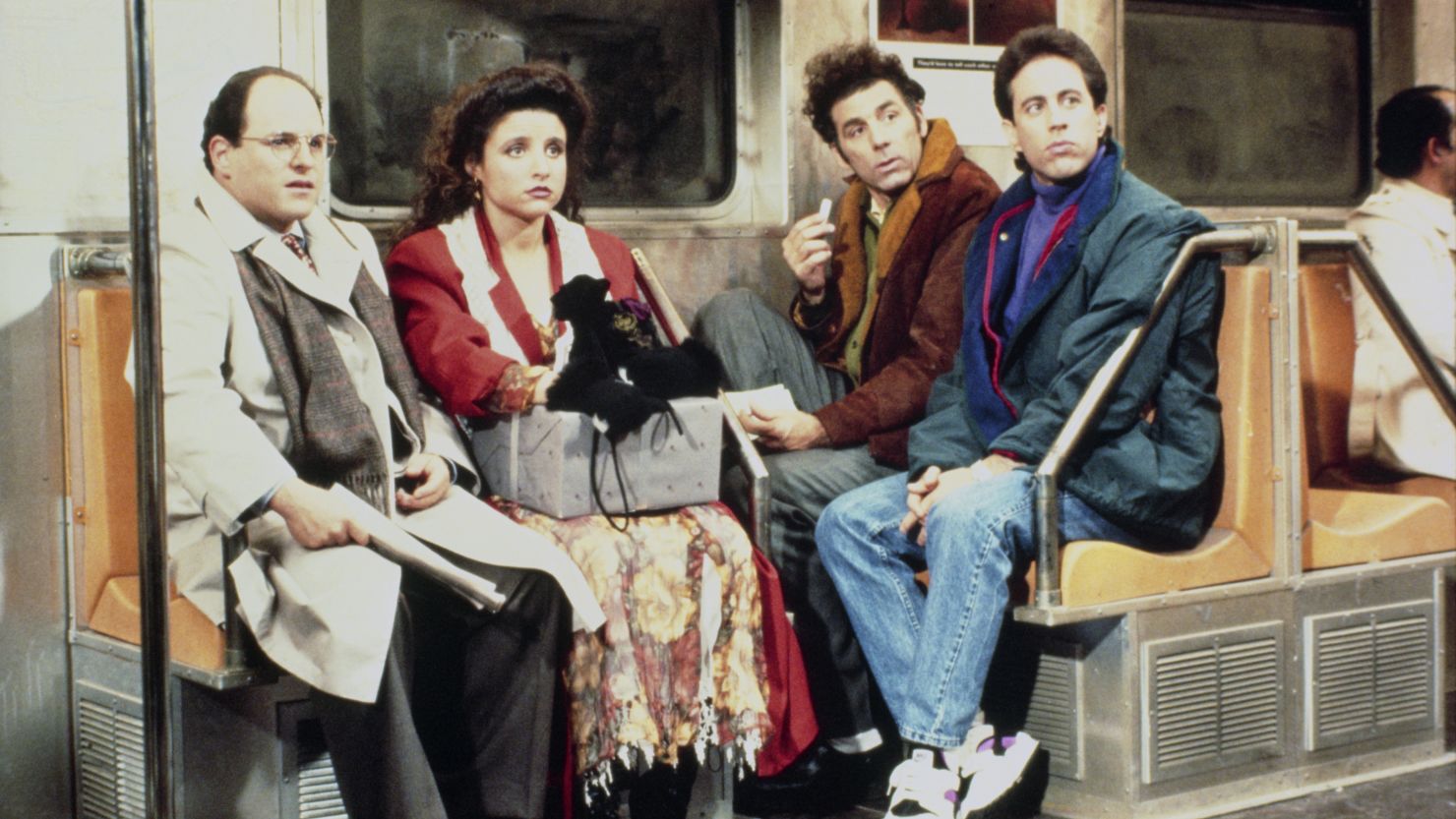 Jason Alexander as George Costanza, Julia Louis-Dreyfus as Elaine Benes, Michael Richards as Cosmo Kramer, and Jerry Seinfeld as Jerry Seinfeld in a scene from "Seinfeld."