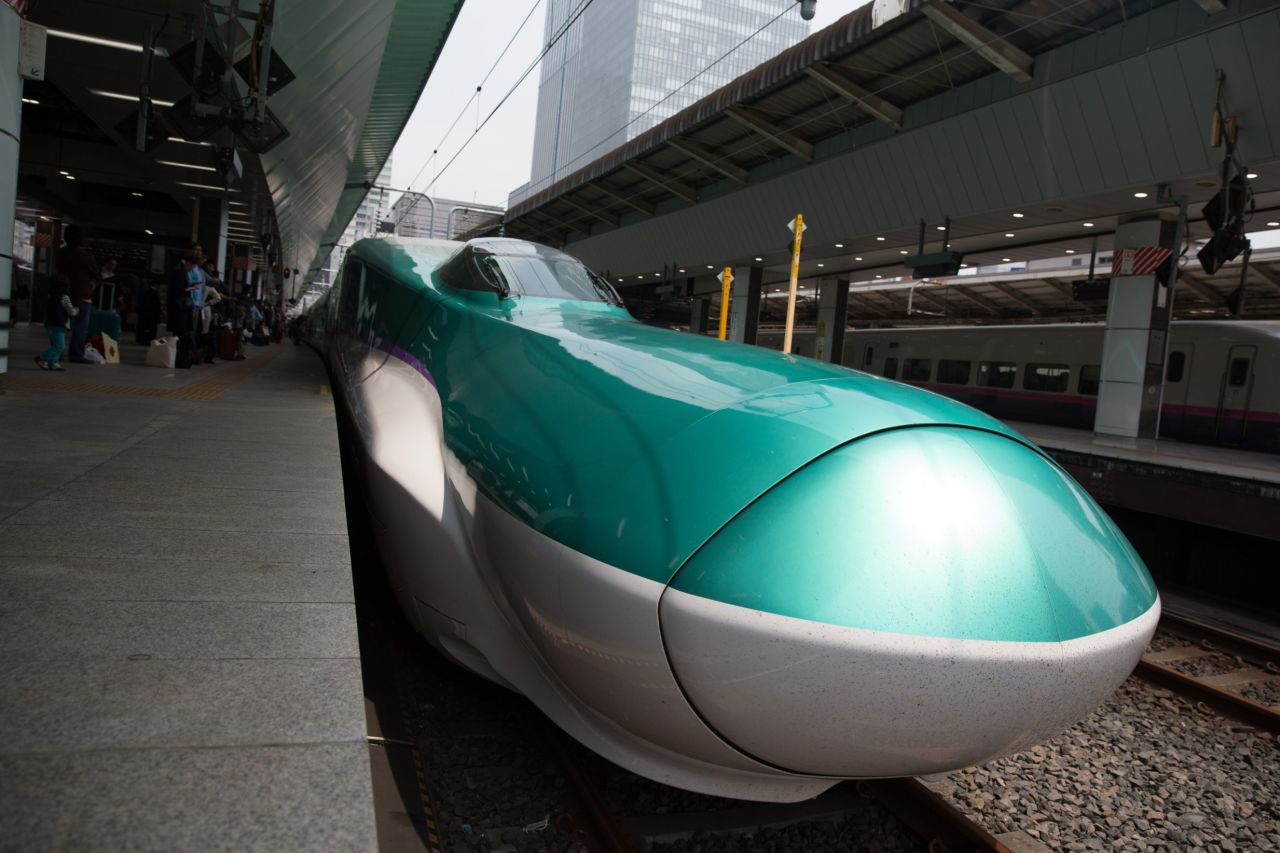Here, a Shinkansen bullet train waits at Tokyo Train Station. The Shinkansen is a network of high-speed railway lines in Japan.