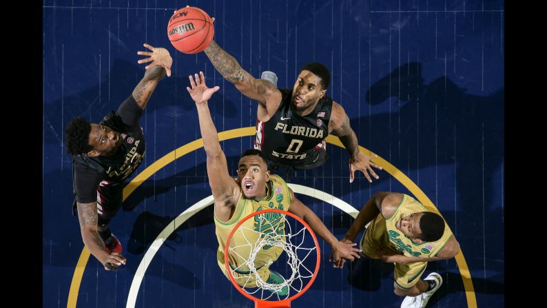 Notre Dame's Bonzie Colson, second from left, competes for a rebound with Florida State's Jarquez Smith, left, and Phil Cofer during a college basketball game in South Bend, Indiana, on Saturday, February 11. Colson had a career-high 33 points and 13 rebounds as Notre Dame won 84-72.