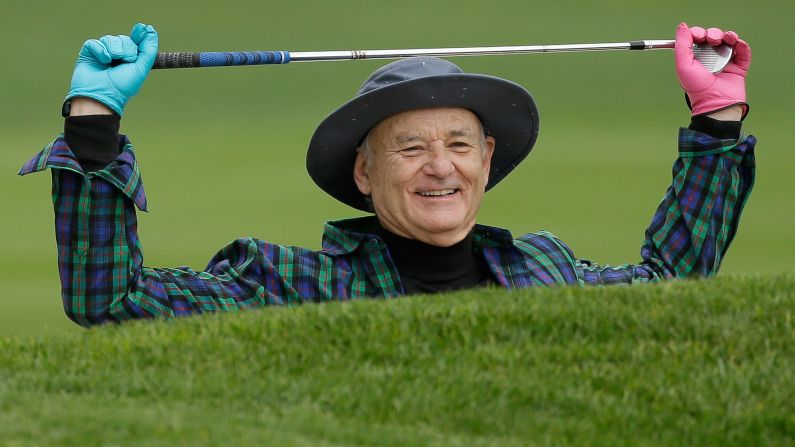 Actor Bill Murray prepares to hit out of a bunker during a celebrity challenge event in Pebble Beach, California, on Wednesday, February 8.
