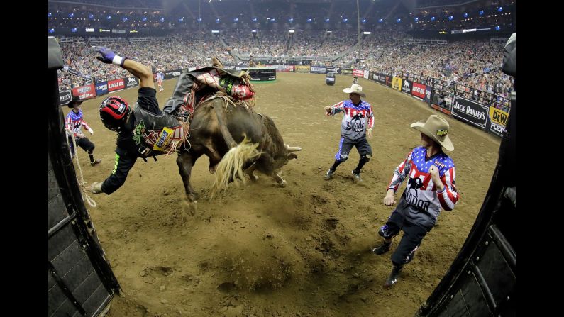 Luis Blanco is thrown from Swamp Wreck during a Professional Bull Riders event in Kansas City, Missouri, on Saturday, February 11.
