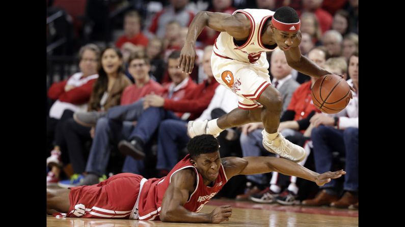 Nebraska's Glynn Watson Jr. leaps over Wisconsin's Khalil Iverson during a college basketball game in Lincoln, Nebraska, on Thursday, February 9.