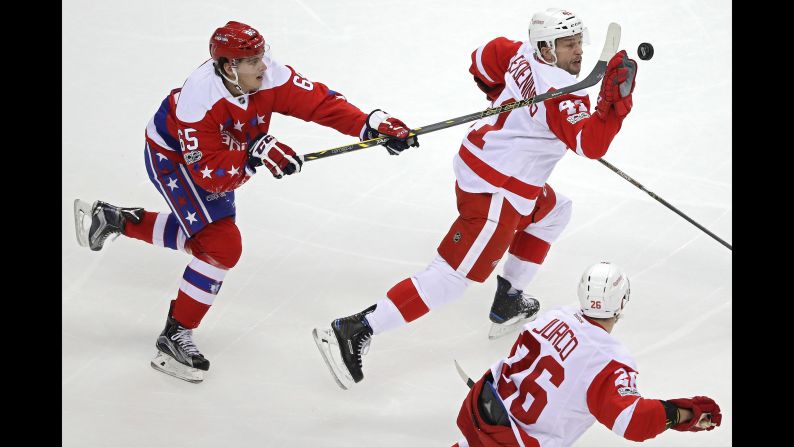 Detroit's Luke Glendening pulls down a puck with his hand during an NHL game in Washington on Thursday, February 9.