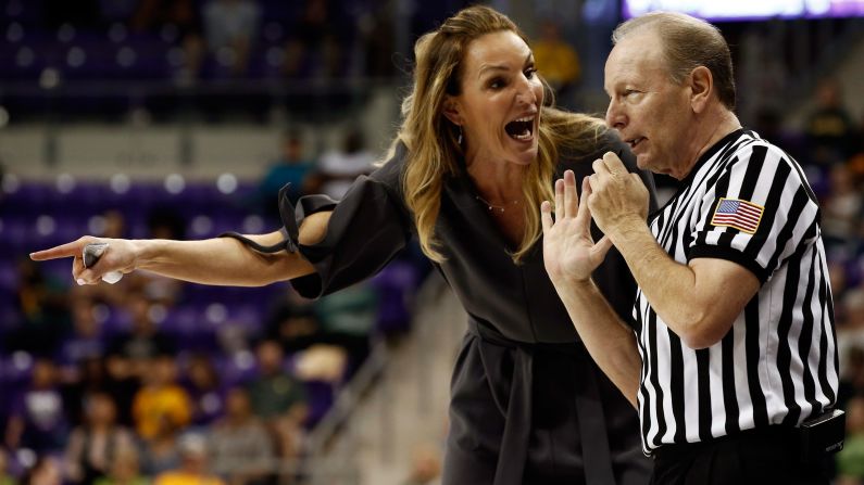 TCU head coach Raegan Pebley talks to official Bob Trammell during a college basketball game in Fort Worth, Texas, on Sunday, February 12.