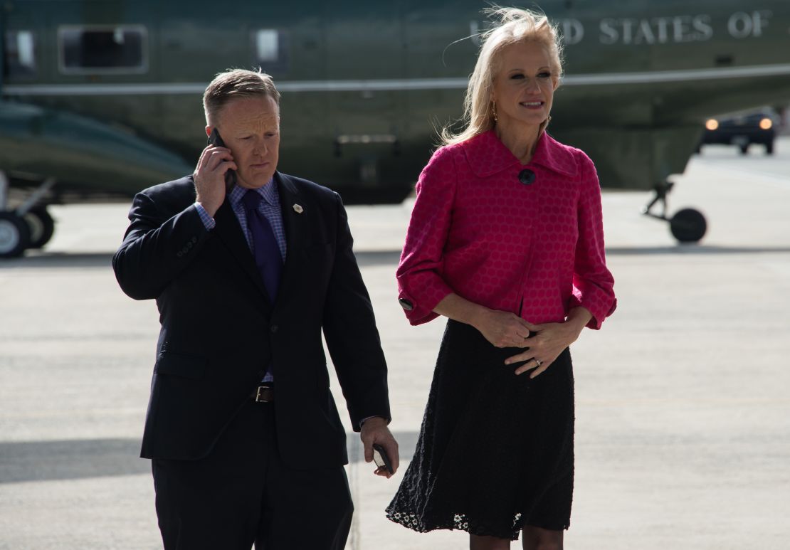 Spicer and Conway wait for Trump's arrival at Andrews Air Force Base 