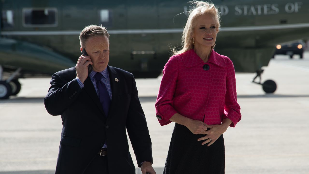 Spicer and Conway wait for Trump's arrival at Andrews Air Force Base 