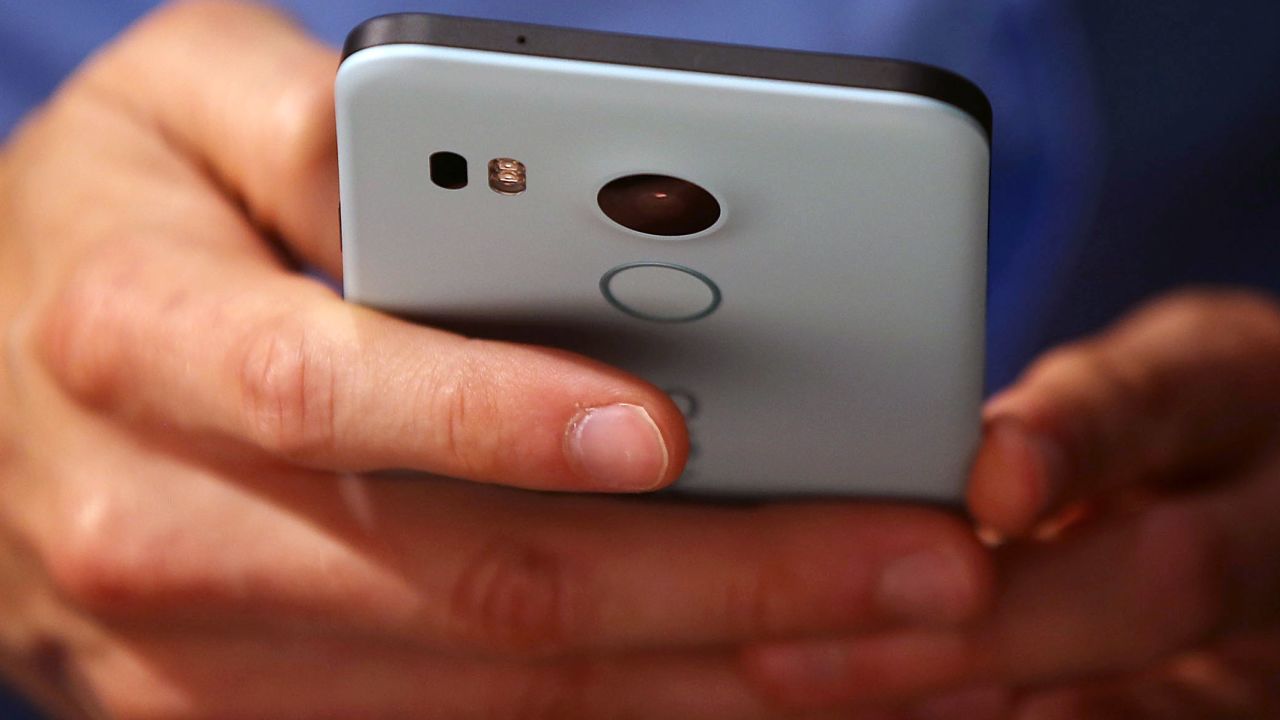 SAN FRANCISCO, CA - SEPTEMBER 29:  An attendee inspects the new Nexus 5X phone during a Google media event on September 29, 2015 in San Francisco, California. Google unveiled its 2015 smartphone lineup, the Nexus 5x and Nexus 6P, the new Chromecast and new Android 6.0 Marshmallow software features.  (Photo by Justin Sullivan/Getty Images)