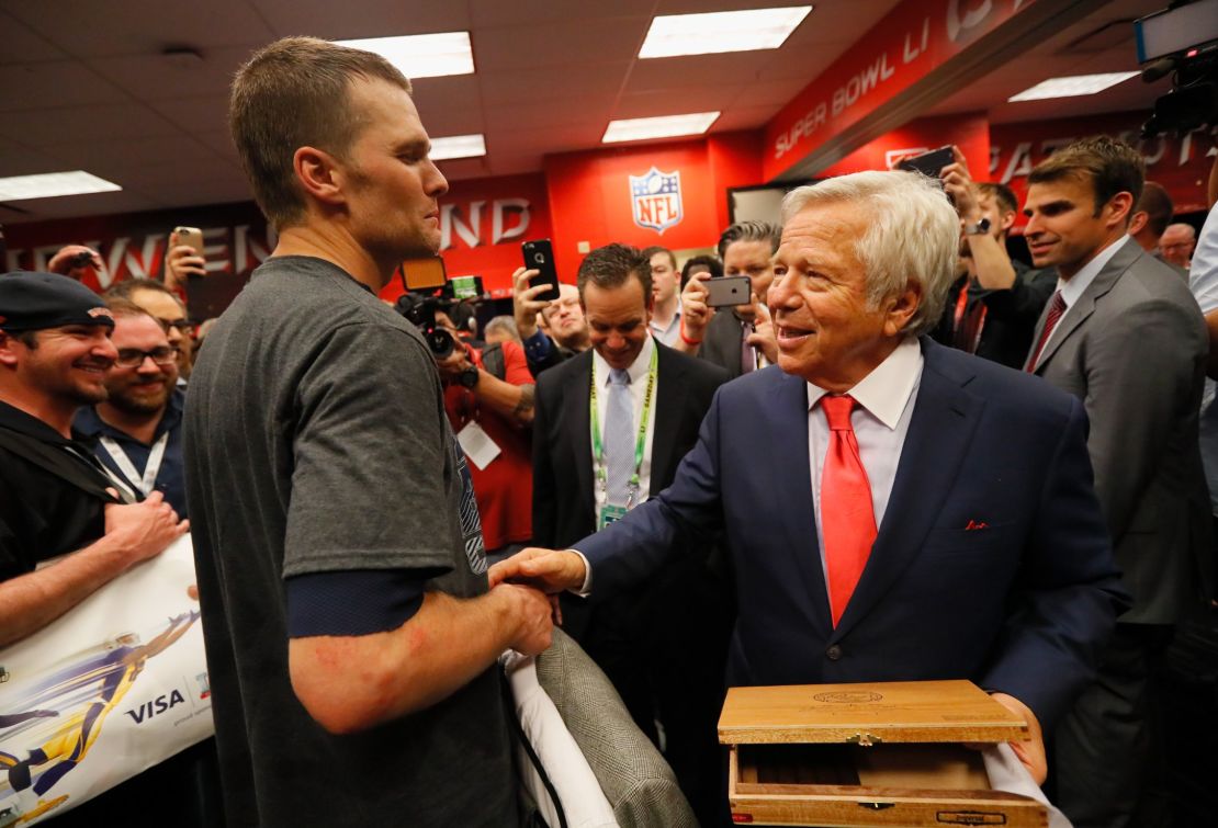 Tom Brady celebrates with New England Patriots owner Robert Kraft in the locker room after defeating the Atlanta Falcons during Super Bowl 51 on February 5, 2017 in Houston, Texas.