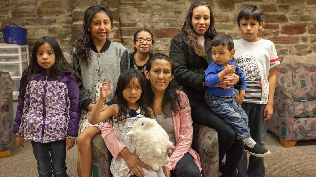 Vizguerra poses at the church with her four children and three grandchildren. Her eldest daughter Tania, described her mother as the "backbone" of their family.