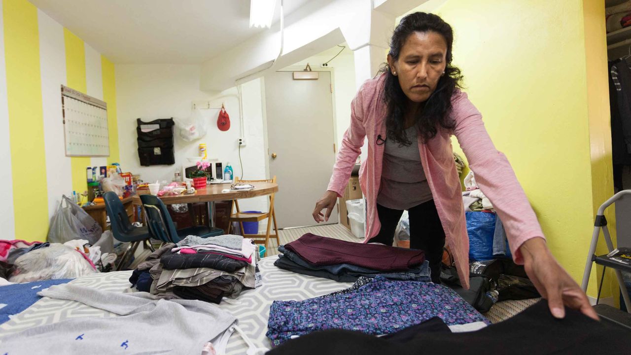 Jeanette Vizguerra unpacks clothes Tuesday night after moving into the church.