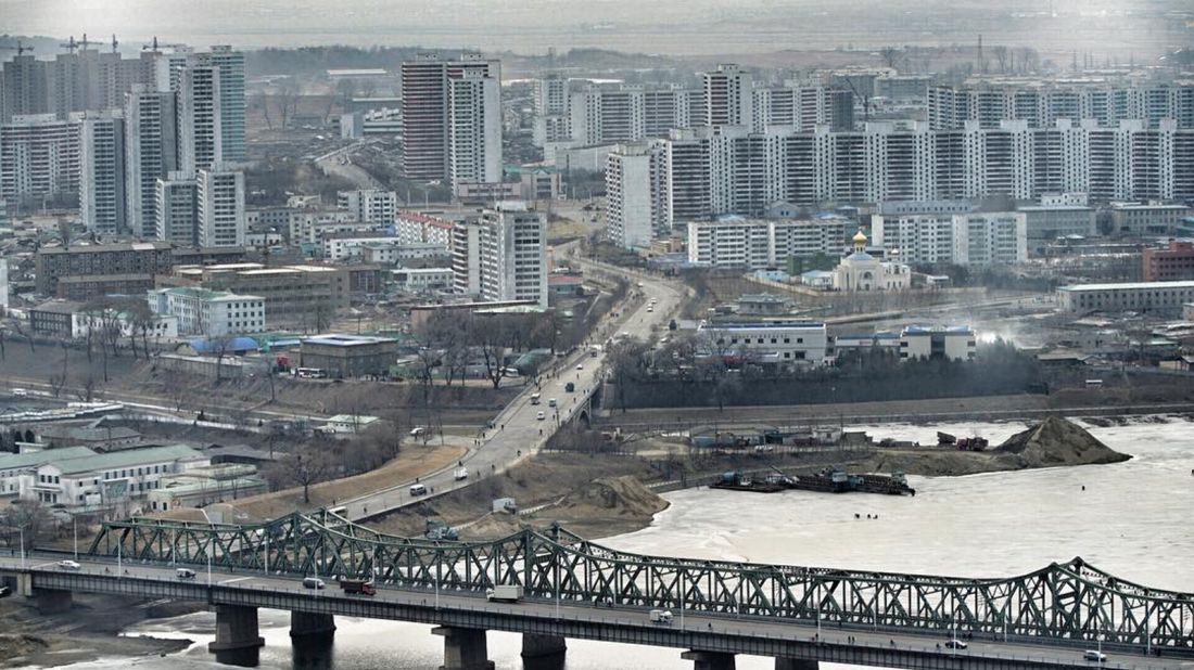 The view over the frozen Taedong River shows residential areas of Pyongyang on February 15.