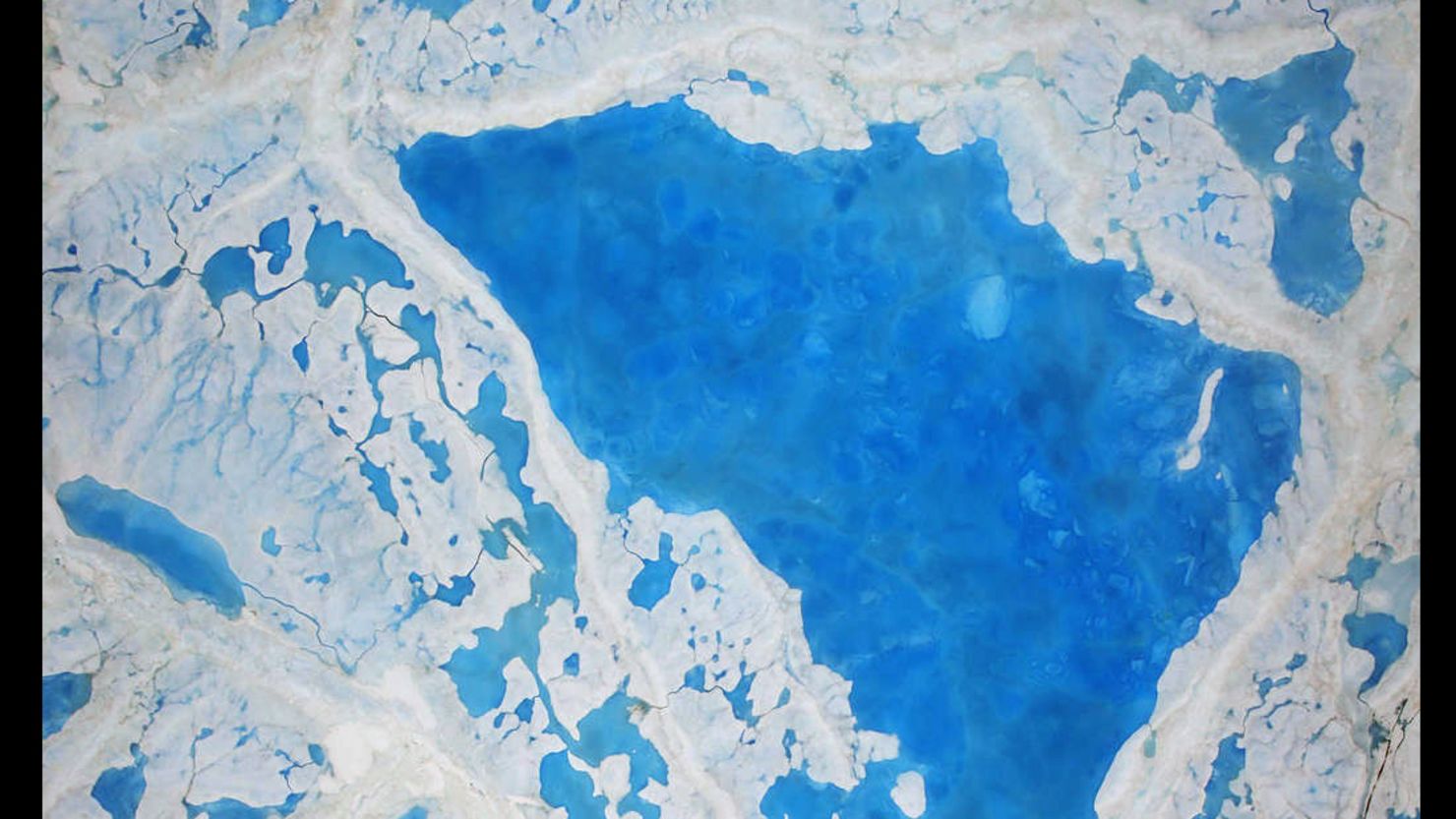Pools of melt are becoming more common on the ice in the Arctic Sea.