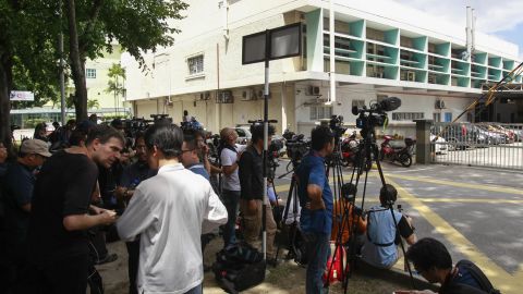 Journalists gather outside a hospital forensic department Wednesday in Kuala Lumpur, Malaysia.