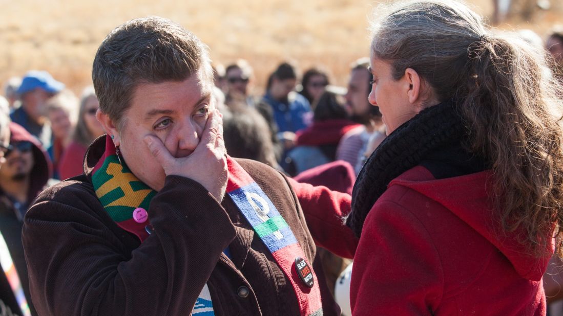 Jennifer Piper of the American Friends Service Committee comforts the Rev. Anne Dunlap outside the ICE office in Denver as they learn that the stay on Vizguerra's deportation order was not extended.