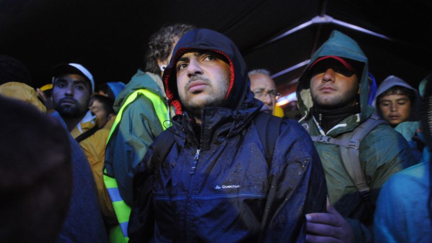 October 10, 2015- Asem Hasna, 21, waits together with thousands of refugees  in huge queues in the cold rain for more thnn 15 hours  to cross the borders from Serbia (Sid) towards Croatia (Opatovac)  (Maro Kouri)