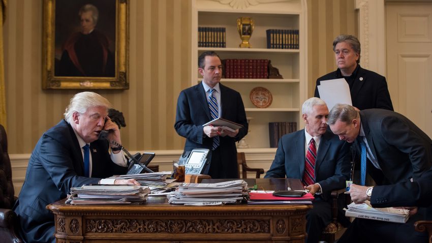 WASHINGTON, DC - JANUARY 28: President Donald Trump speaks on the phone with Russian President Vladimir Putin in the Oval Office of the White House, January 28, 2017 in Washington, DC. Also pictured, from left, White House Chief of Staff Reince Priebus, Vice President Mike Pence, White House Chief Strategist Steve Bannon, and Press Secretary Sean Spicer. On Saturday, President Trump is making several phone calls with world leaders from Japan, Germany, Russia, France and Australia. (Photo by Drew Angerer/Getty Images)