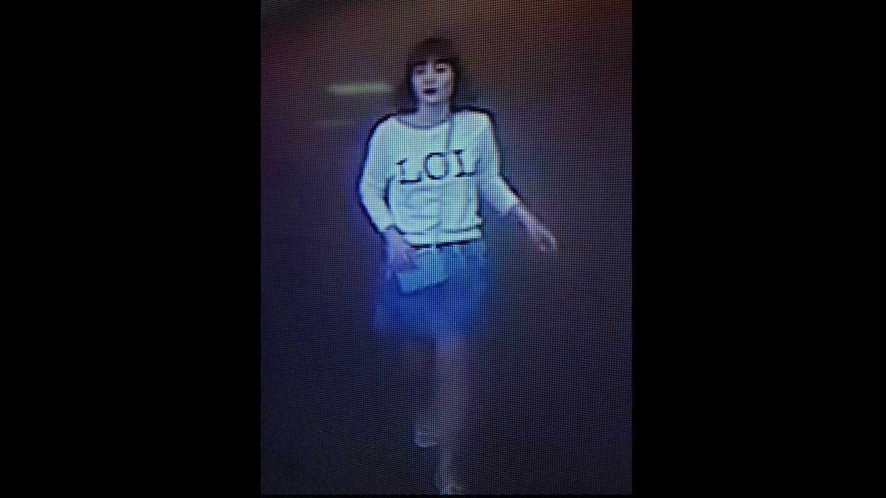 Surveillance footage shows woman with "LOL" shirt