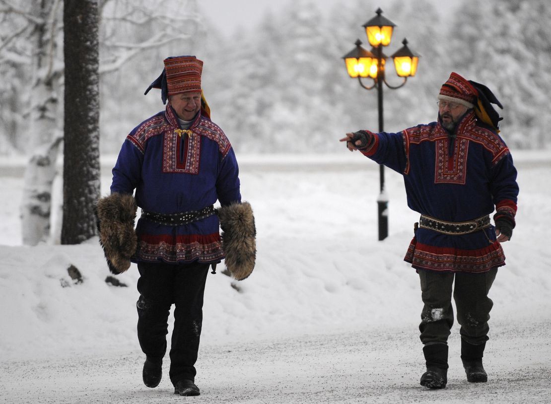 A couple in traditional Sami costume are seen in Rovaniemi.