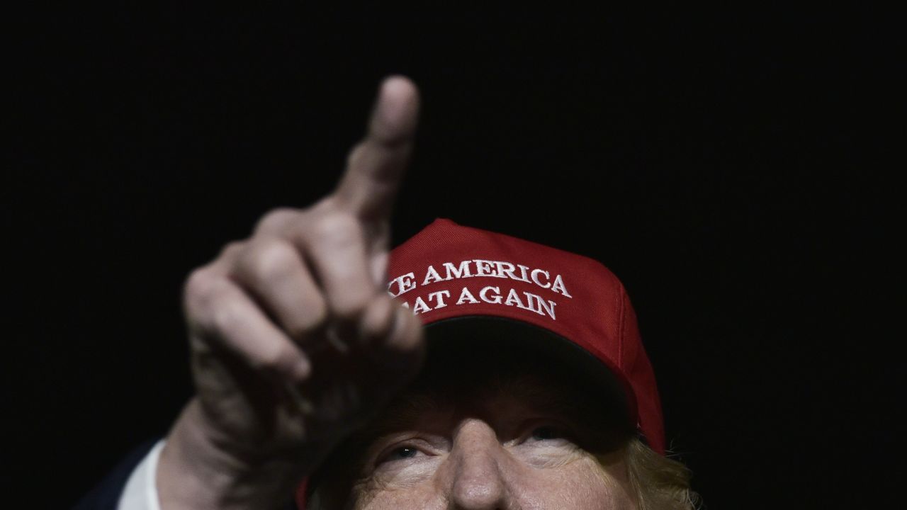 TOPSHOT - US Republican presidential nominee Donald Trump addresses a campaign rally at Atlantic Aviation in Moon Township, Pennsylvania on November 6, 2016. / AFP / MANDEL NGAN        (Photo credit should read MANDEL NGAN/AFP/Getty Images)