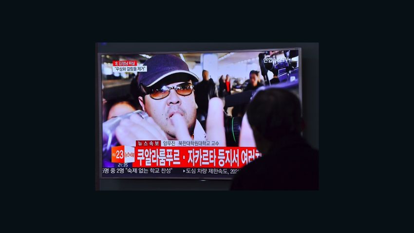 A man watches a television showing news reports of Kim Jong-Nam, the half-brother of North Korean leader Kim Jong-Un, in Seoul on February 14, 2017.