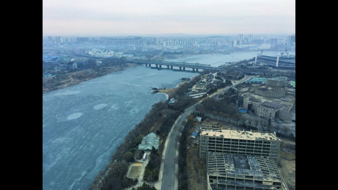 Ice flows down the Taedong River in Pyongyang on February 16.
