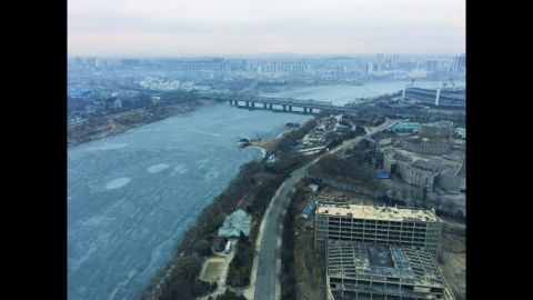 Ice flows down the Taedong River in Pyongyang on February 16.