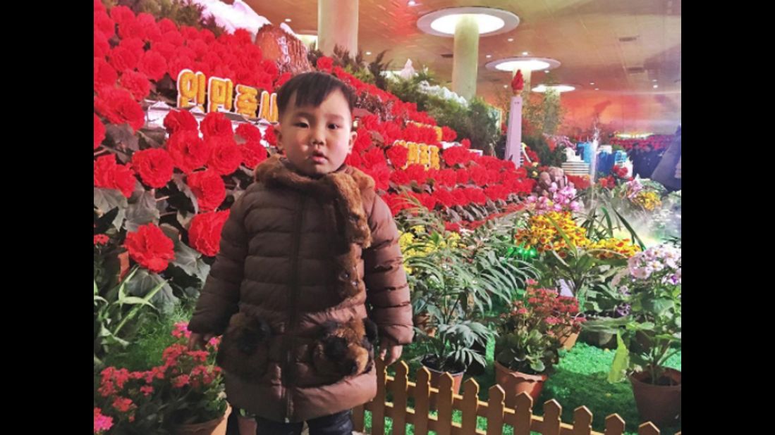 A boy visits the Kimjongilia flower show on February 16. The red flowers are named after the late North Korean leader Kim Jong Il.