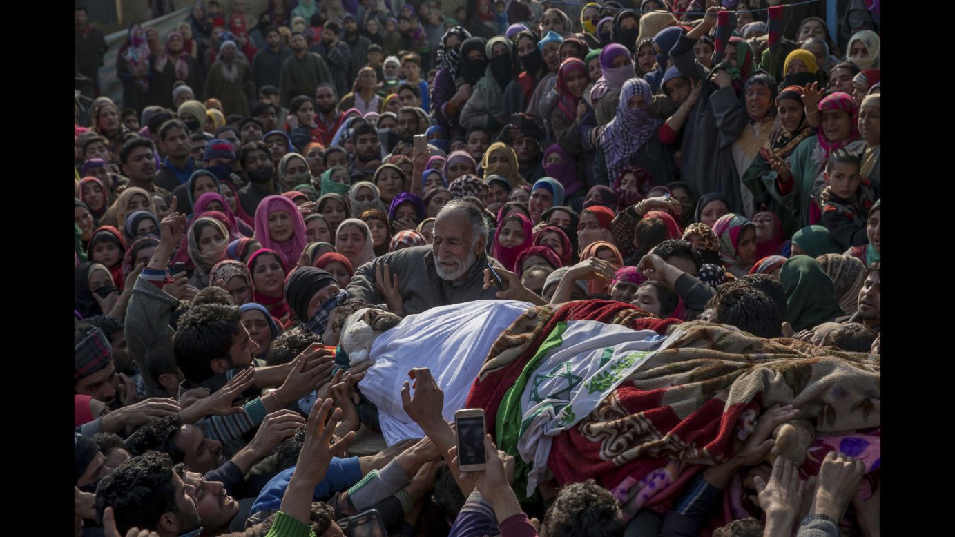The father of Mudasir Ahmed cries over the body of his son, one of four suspected rebels killed in a gun battle in Indian-controlled Kashmir on Sunday, February 12. Two Indian soldiers and a civilian were also killed, officials said. <a href="http://www.cnn.com/2016/09/30/asia/kashmir-explainer/" target="_blank">Read more: The Kashmir dispute explained</a>