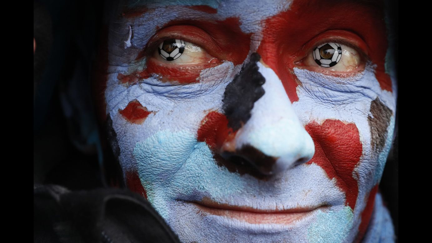 A fan of the English soccer club Burnley is photographed before a Premier League match on Sunday, February 12.