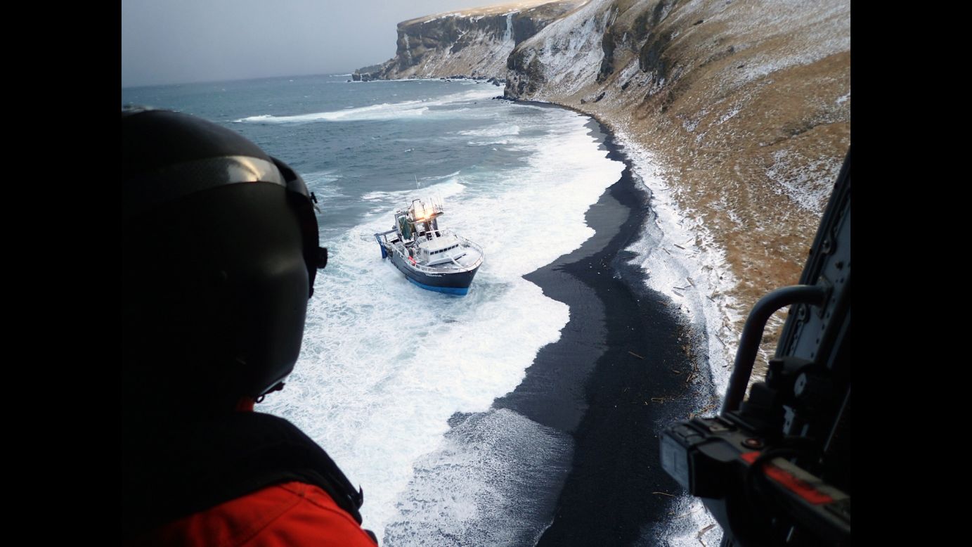 A US Coast Guard crew prepares to rescue people from a fishing boat that ran aground in Cold Bay, Alaska, on Tuesday, February 14.
