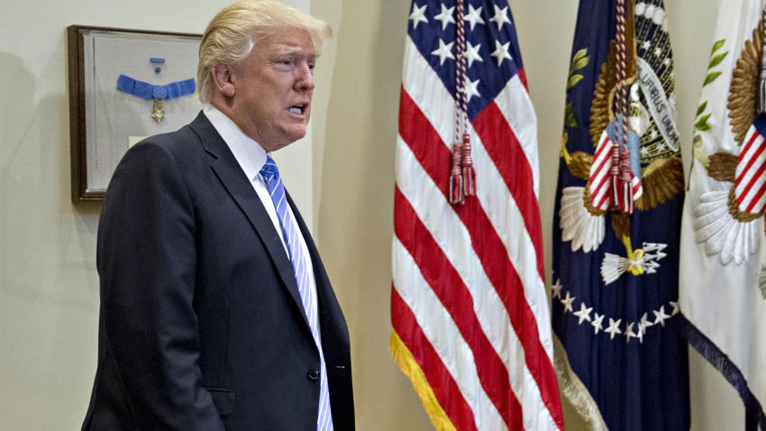 WASHINGTON, D.C. - FEBRUARY 15: (AFP-OUT) U.S. President Donald Trump arrives for a listening session with the Retail Industry Leaders Association and member company chief executive officers in the Roosevelt Room of the White House on February 15, 2017 in Washington, D.C. Questions about ties between Trump's team and Russian intelligence agents mounted Wednesday after news of extensive contacts between the two were reported. Democrats and some Republicans are calling for an investigation into Trump's links to Russia. (Photo by Andrew Harrer-Pool/Getty Images)