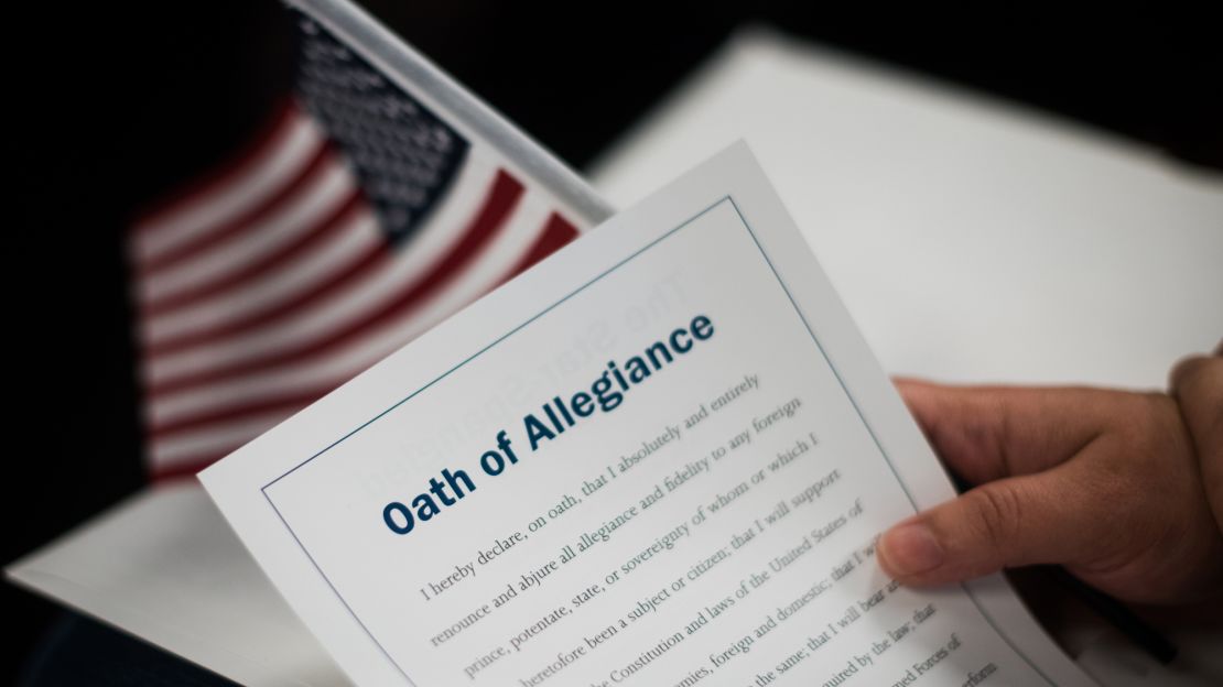 The citizenship packet contains a card-sized Oath of Allegiance.