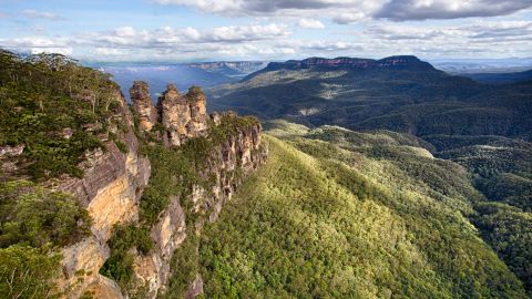 Explore Australia's wonders, including The Three Sisters in the Blue Mountains.