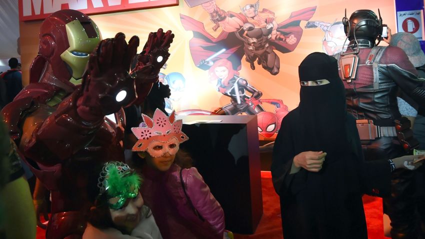 A Saudi woman looks on as children pose for a photo with a man dressed up as "Iron Man" during the country's first ever Comic-Con event in the coastal city of Jeddah on February 16, 2017.
The three-day festival of anime, pop art, video gaming and film-related events is part of a government initiative to bring more entertainment to Saudi Arabia which bans alcohol, public cinemas and theatre. / AFP / FAYEZ NURELDINE        (Photo credit should read FAYEZ NURELDINE/AFP/Getty Images)